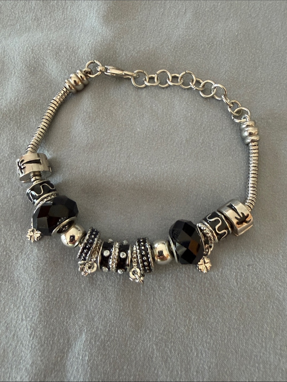 Silver-Tone Bracelet with Black Faceted Beads and Charms